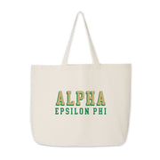 Alpha Epsilon Phi canvas tote bag with raised-style sorority name, photographed on a white background.