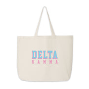 Delta Gamma tote bag with raised-style Greek letters printed on cotton, set against white.