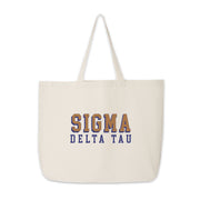 Sigma Delta Tau cotton tote with modern 3D-style sorority lettering, laid out on white.