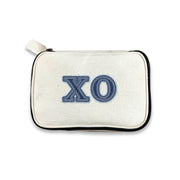 Chi Omega sorority makeup bag with Chi O Greek letters in denim-style print, on a white background.