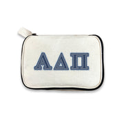 Alpha Delta Pi sorority makeup bag featuring denim-style ADPi letters, photographed on a white backdrop.