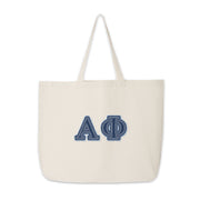 Alpha Phi tote bag with denim-style Greek letters shown on a simple background.