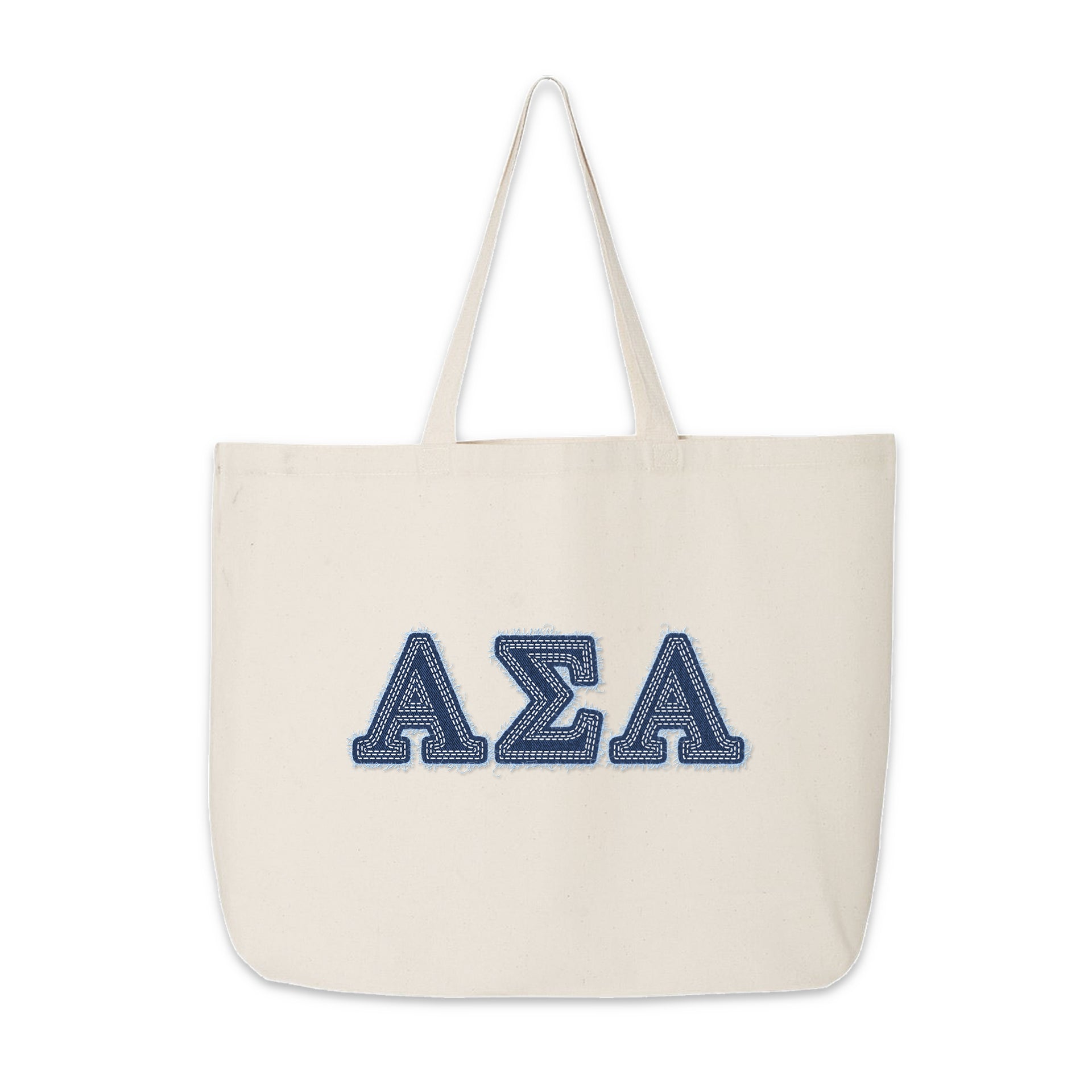 Canvas Alpha Sigma Alpha tote with denim letters displayed on a wooden surface.