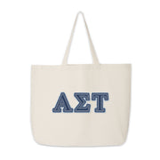 Alpha Sigma Tau denim letter tote bag shown front-facing on a neutral backdrop