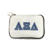 Alpha Xi Delta canvas cosmetic bag printed with AXiD denim-style Greek letters, shown on white.
