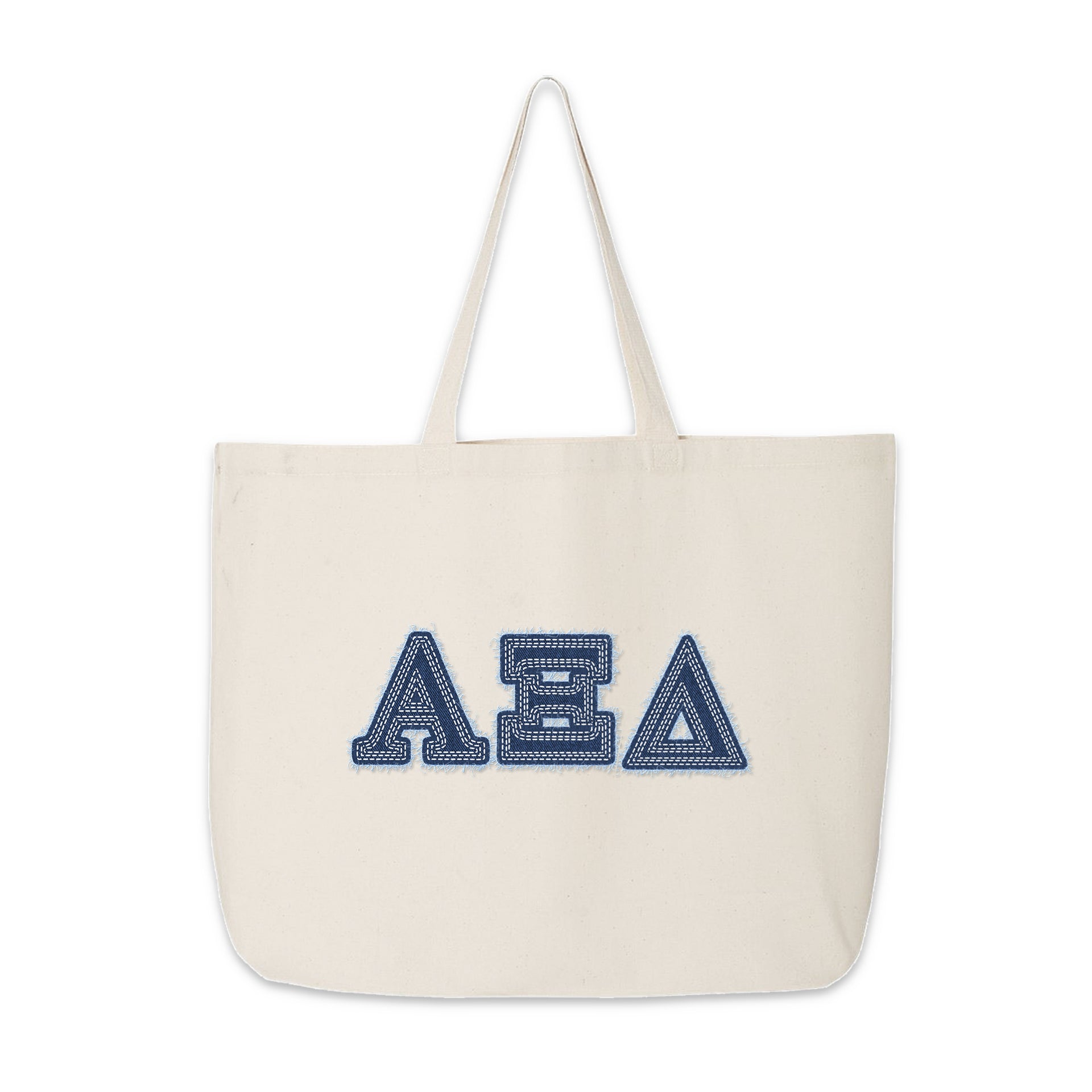 Front view of Alpha Xi Delta tote bag with denim Greek letters against a white background
