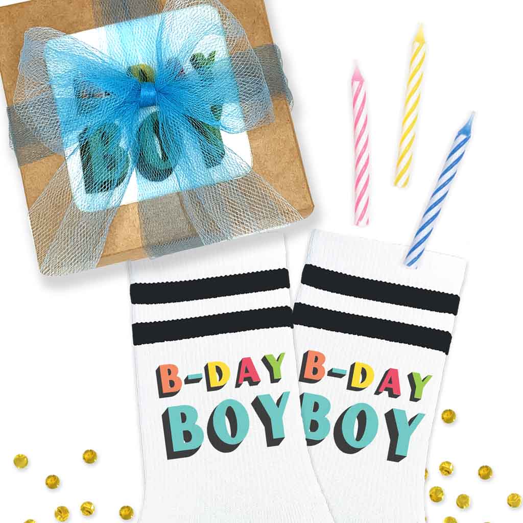 Black striped white socks printed with “B-Day Boy” text on both sock outsides