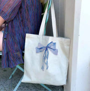 Versatile and stylish, it's perfect for book clubs, bridal party essentials, or as a fashionable shopping tote. Elevate your accessory options with this trendy and practical tote!