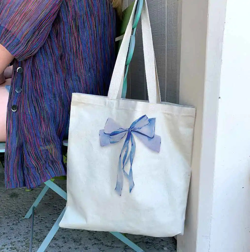 Versatile and stylish, it's perfect for book clubs, bridal party essentials, or as a fashionable shopping tote. Elevate your accessory options with this trendy and practical tote!