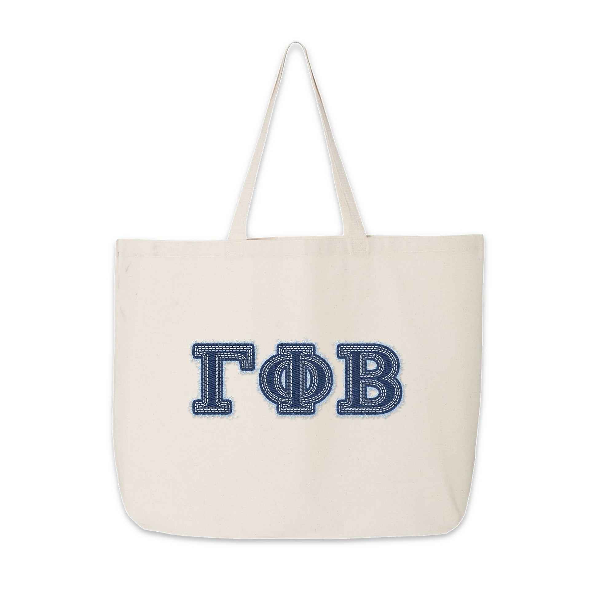 Gamma Phi Beta tote with denim letters photographed for product showcase.