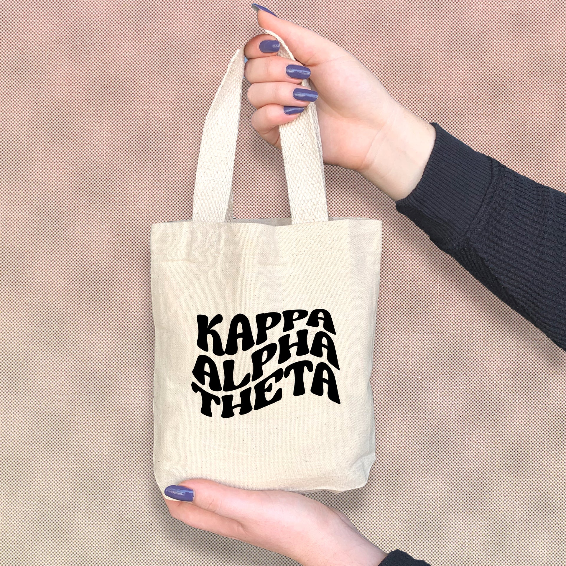 Kappa Alpha Theta mini sorority tote carried by a Theta sister, ideal for daily errands.