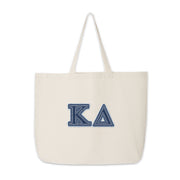 Kappa Delta denim-style letter tote bag photographed flat for product detail.
