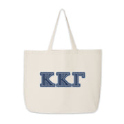 Kappa Kappa Gamma tote with denim Greek letters shown standing upright.