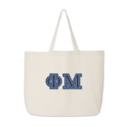 Phi Mu canvas tote with denim Greek letters displayed for product view.