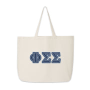 Phi Sigma Sigma tote with denim Greek letters shown in a flat-lay design.