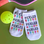 Cute and trendy pickleball no show ankle socks printed with a colorful PICKLED text and pickleball paddle design.