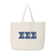 Denim Sigma Sigma Sigma letter tote laid flat for clear product view.