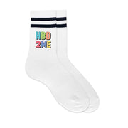 Striped white socks printed with “Happy Birthday to Me” and boxed for gifting