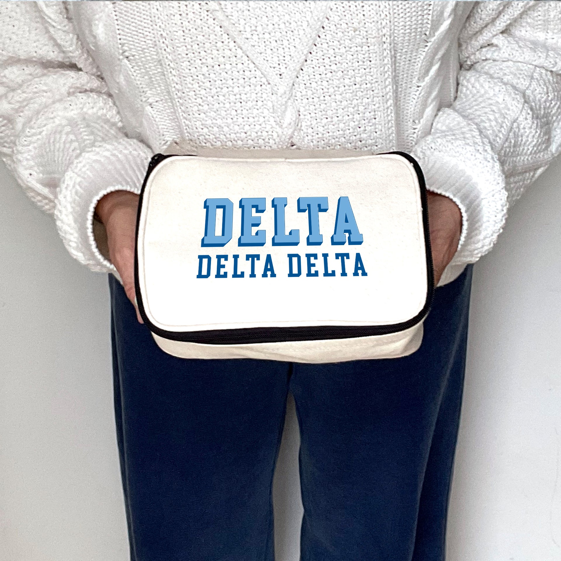 Angled view of Delta Delta Delta 3D Print Sorority Name Cosmetic Make Up Bag showcasing 3D lettering