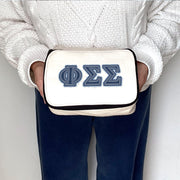 Phi Sigma Sigma cosmetic bag featuring denim-style Phi Sigma Sigma letters, held up close.