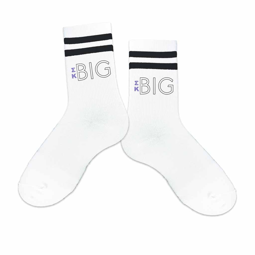 Big or little Sigma Kappa sorority socks printed with SK Greek letters on black striped crew socks.