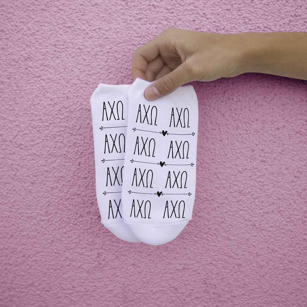 Alpha Chi Omega sorority letters repeating custom printed on white cotton crew socks.