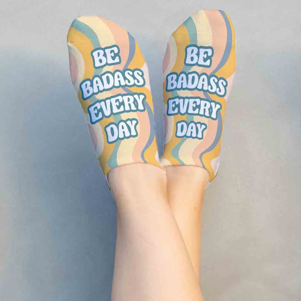 Be Badass Everyday self motivation statement digitally printed on no show socks.