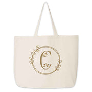 Large monogrammed bridesmaid tote bag personalized with a floral theme design.