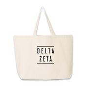 Sorority name in block capital letters with two lines on either side printed on canvas tote bag.