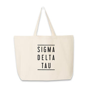 Sorority name in block capital letters with two lines on either side printed on canvas tote bag.