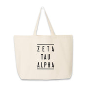 Sorority name in block capital letters with two lines on either side printed on canvas tote bag.