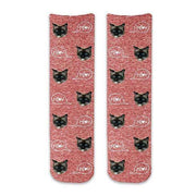 Custom printed cat face photo socks using your own photos printed in all over design on red granular background and meow text bubble digitally printed on cotton crew socks.