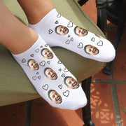 Custom face photo socks with a heart design personalized using your own photo and hearts design printed all over the top of the socks.