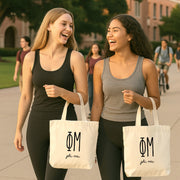 Phi Mu small canvas tote bag with striped Greek letters styled in a flat lay with everyday essentials