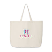 Pi Beta Phi tote bag with raised sorority name print on canvas, shown against white.