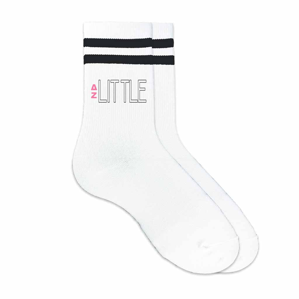 DZ Greek letters big or little design digitally printed on the outside of black striped crew socks.