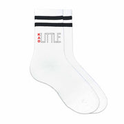 KAT Greek letters big or little design printed on the outside of the black striped crew socks.