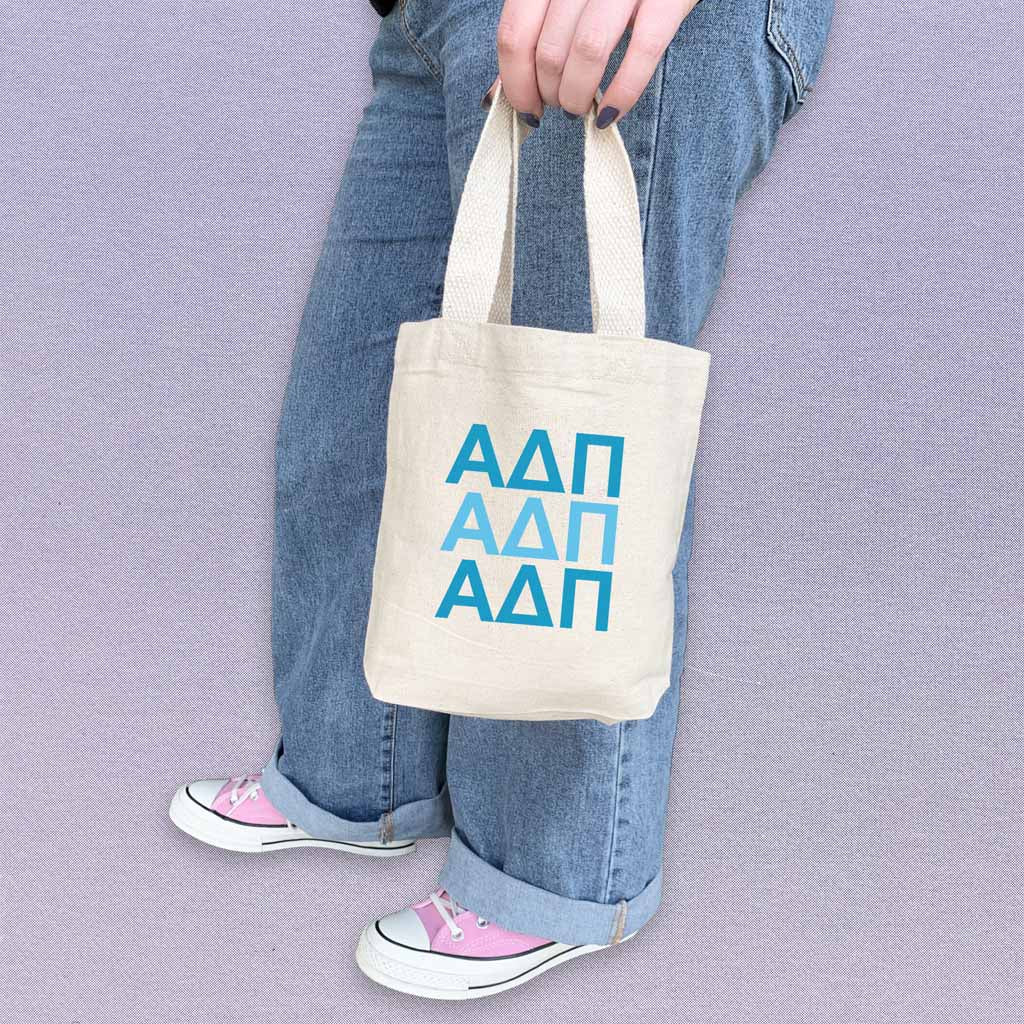 AD Pi sorority letters in sorority colors digitally printed on the perfect mini size natural canvas tote bag.