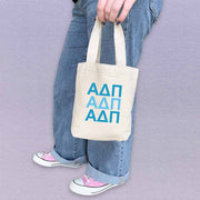 AD Pi sorority letters in sorority colors digitally printed on the perfect mini size natural canvas tote bag.