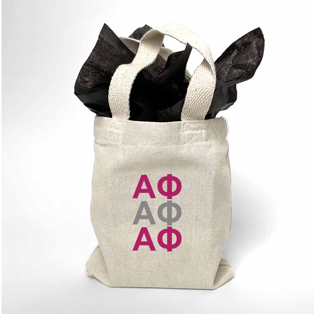 Sorority letters printed in sorority colors on mini natural canvas tote bag makes the perfect gift for your sorority sisters.