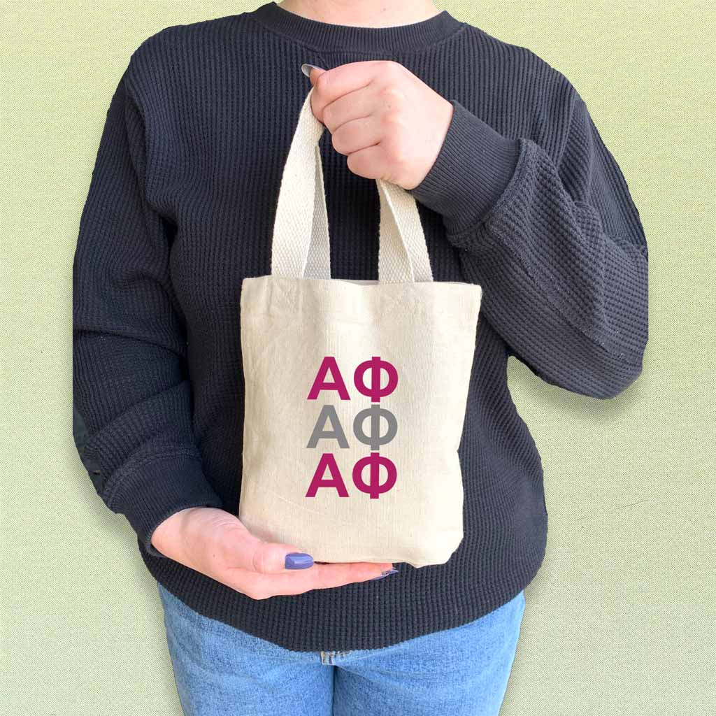 Alpha Phi sorority letters in sorority colors digitally printed on the perfect mini size natural canvas tote bag.