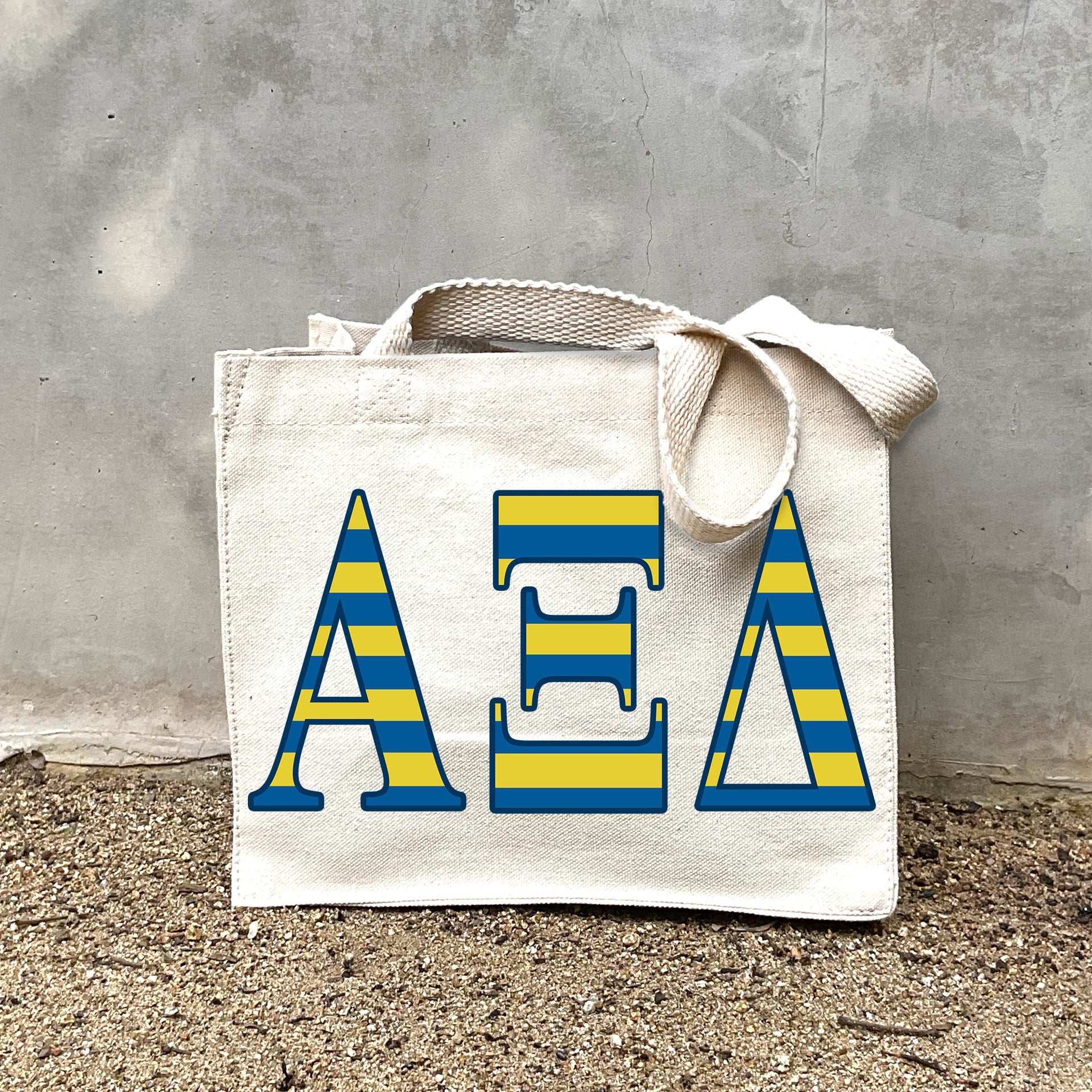 AXiD Sorority Stripe In Sorority striped letters on a small canvas tote bag