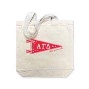 Alpha Gamma Delta collegiate pennant medium size canvas tote bag featuring AGD Greek letters on a white background