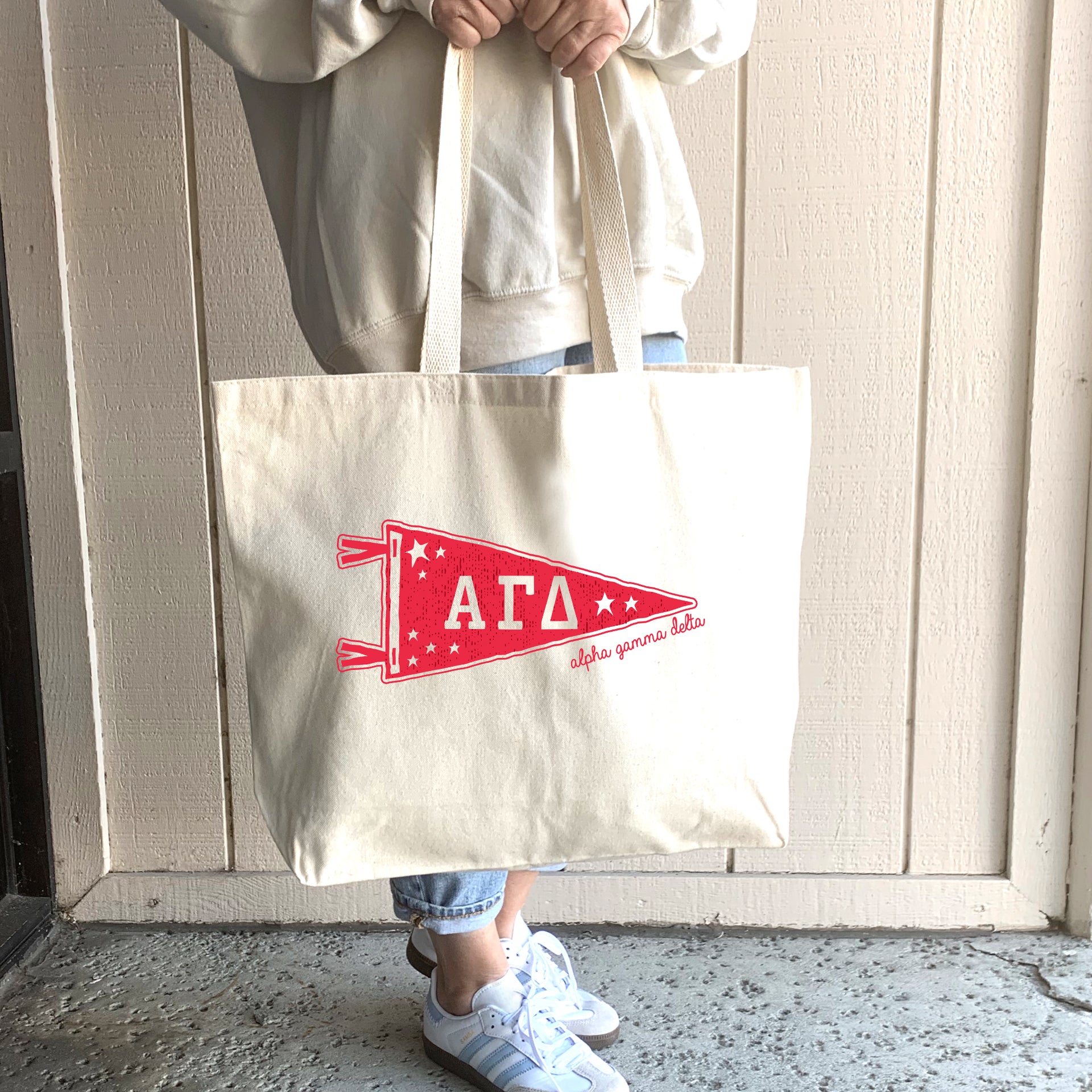 Alpha Gamma Delta Collegiate Pennant design on a large canvas tote bag