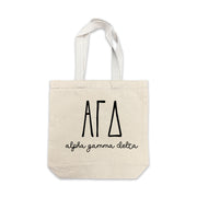 Alpha Gamma Delta small canvas tote bag featuring striped Alpha Gamma Delta Greek letters on a white background