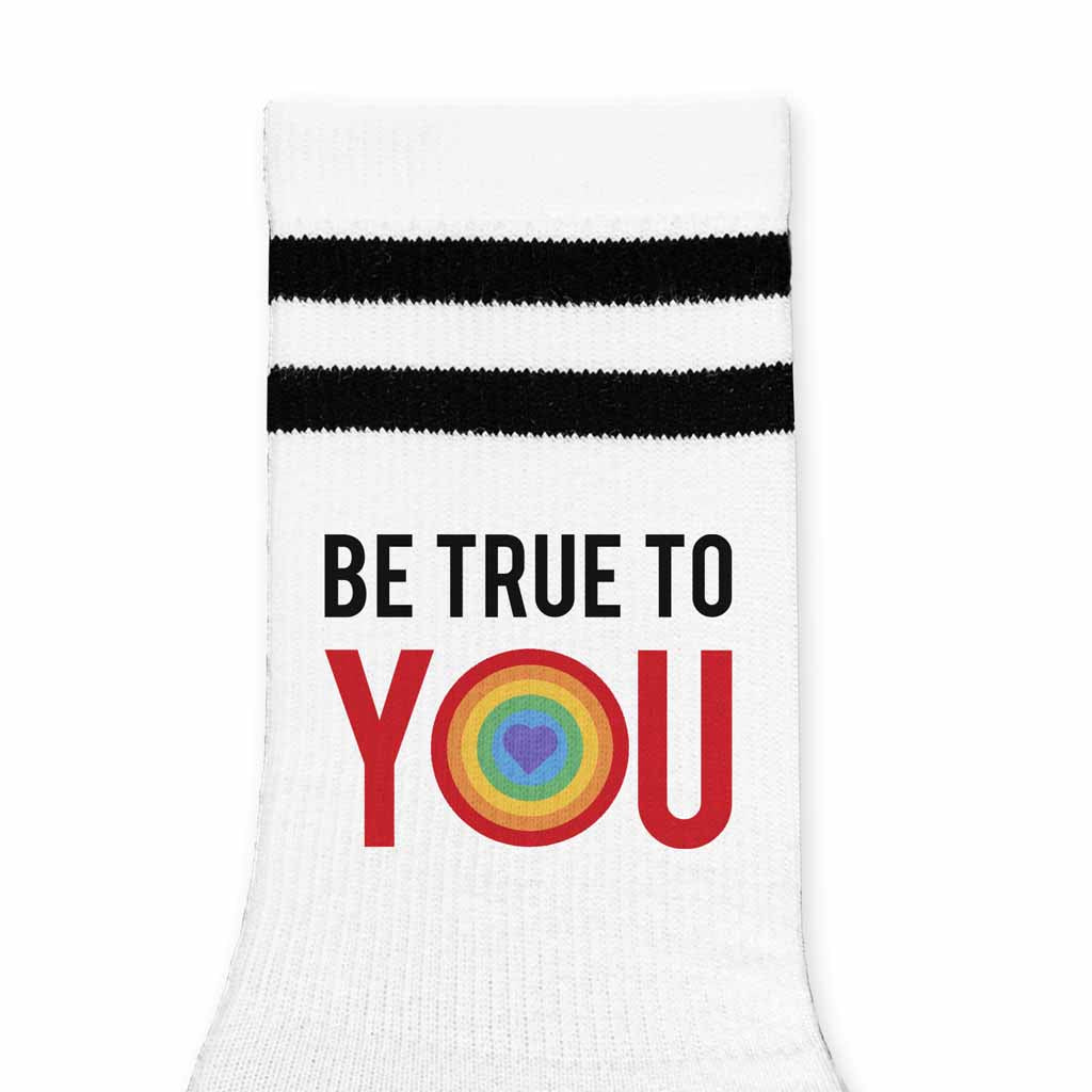 Be true to you LGBTQ design digitally printed on white cotton crew socks with black stripes.