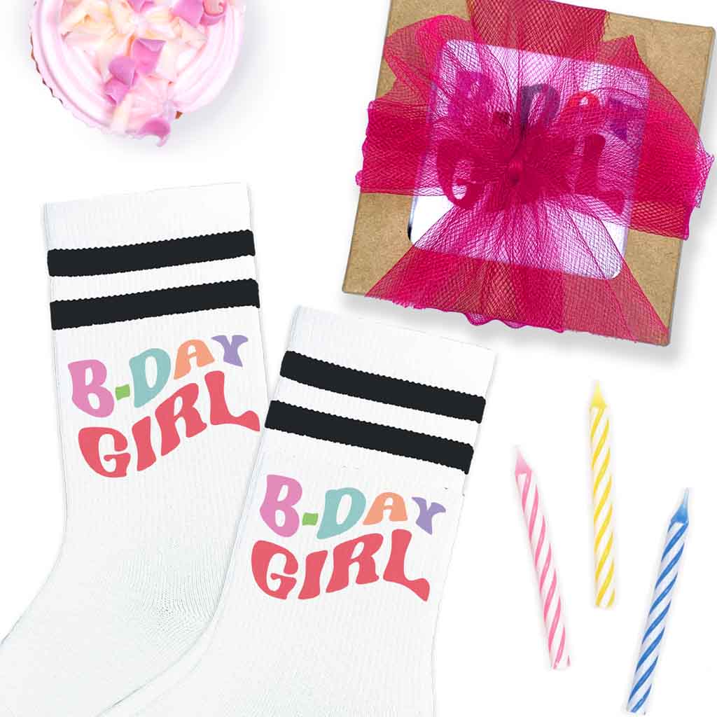 Happy birthday socks for the birthday girl digitally printed on white socks with black stripes.