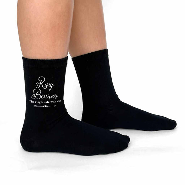The perfect accessory for your wedding day for your ring bearer are these printed socks with the ring is safe with me fun saying printed on the outsides of both flat knit dress socks.