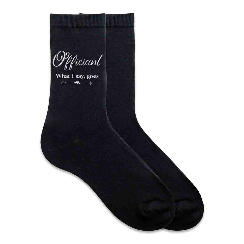 These cotton socks printed with officiant wedding party role and fun saying what I say goes on the side of the socks make a practical gift for your wedding party.