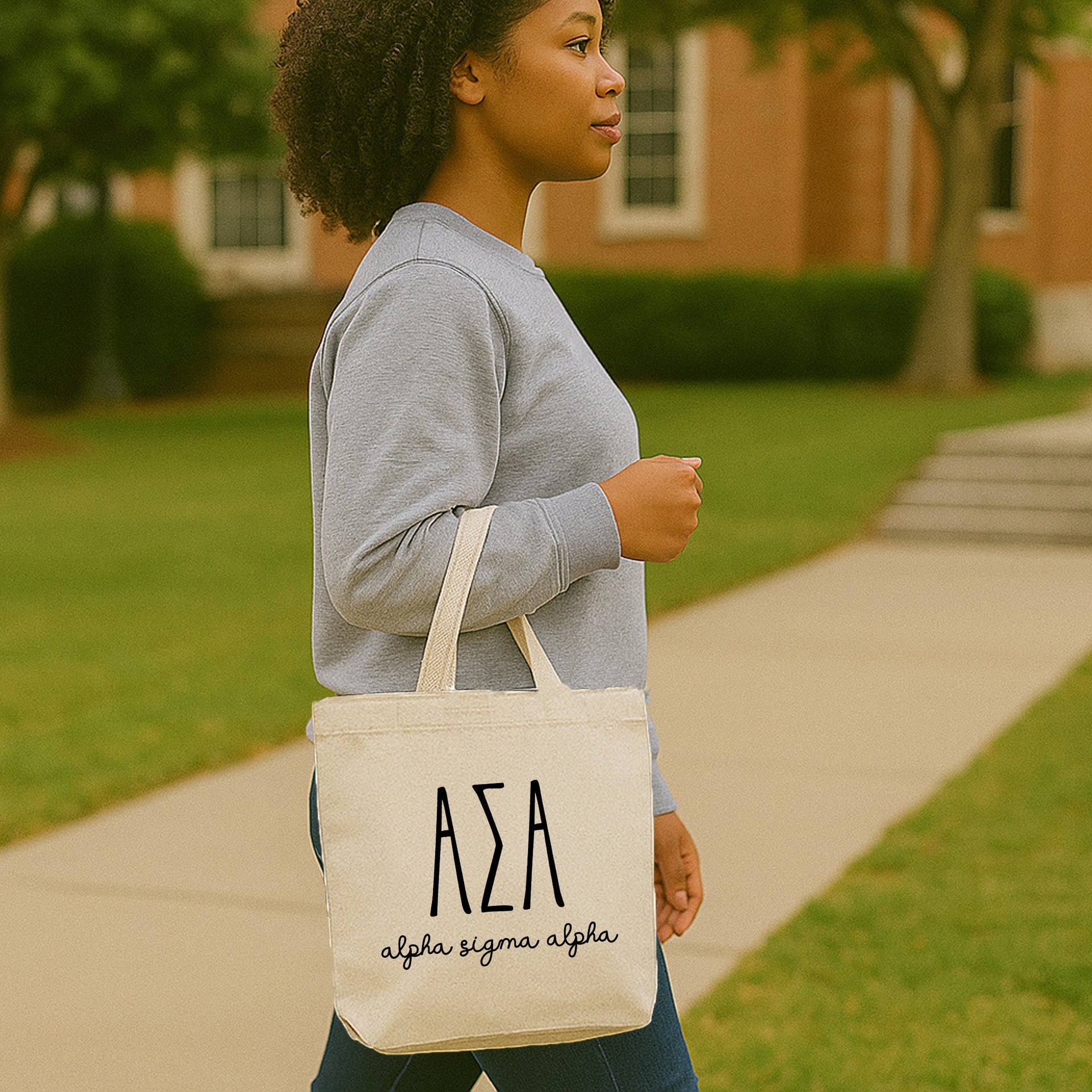 Alpha Sigma Alpha small tote bag sitting on a picnic blanket with a fresh, modern ASA sorority design.
